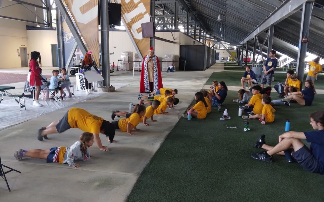 Kids doing push ups for a Florida-based children's educational television program called The Pig Club, a show created to help kids make healthier eating choices.